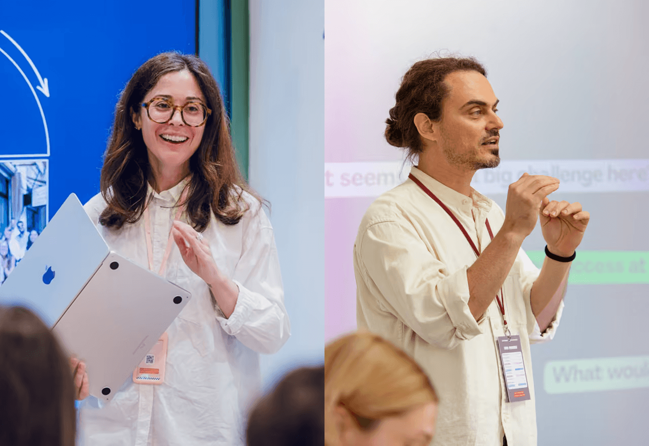 The Coworkies founding team: Pauline Roussel and Dimitar Inchev at a coworking industry event, surrounded by workspace professionals and community builders